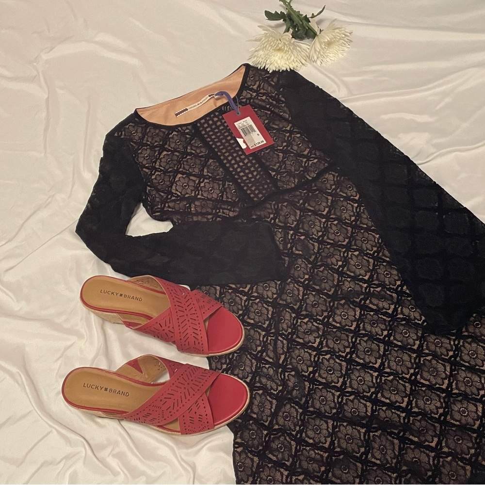 Beautiful black lace dress with beautiful beige layer underneath.